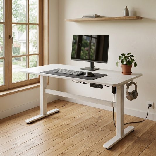 The Kinetic T-Frame height-adjustable desk in a bright home office beside a window